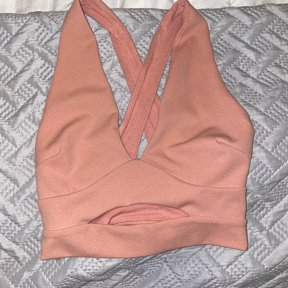 Pink crop top with cut out in stomach